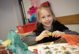 A child is crafting. 