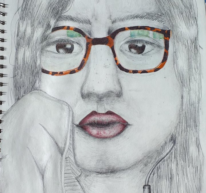 A pencil drawing of a young girls face