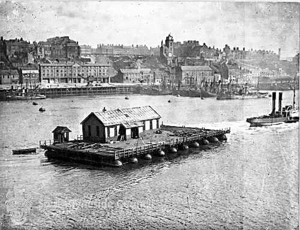  The partially dismantled structure is towed away to the breakers.