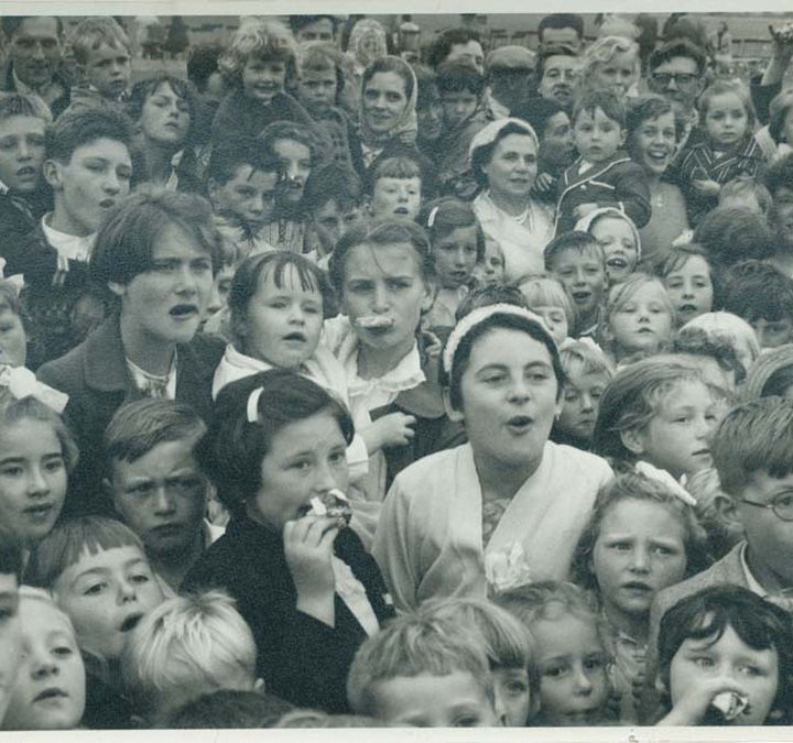 a photograph of a group of children at an annual sports day 