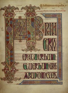 Red, blue and gold drawings of shapes and lettering form the opening page of the Gospel of St John