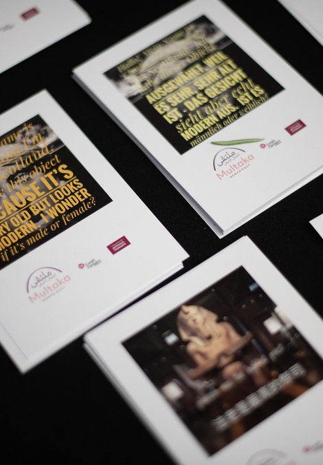 Postcards laid out on a table.