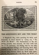 A print of a boy and a wolf on book page, with some printed text.