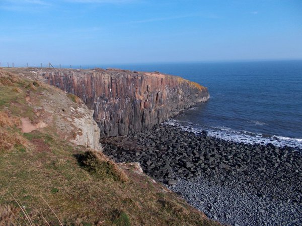Photo of the Whin Sill cliffs of Cullernose Point near Craster, Northumberland.