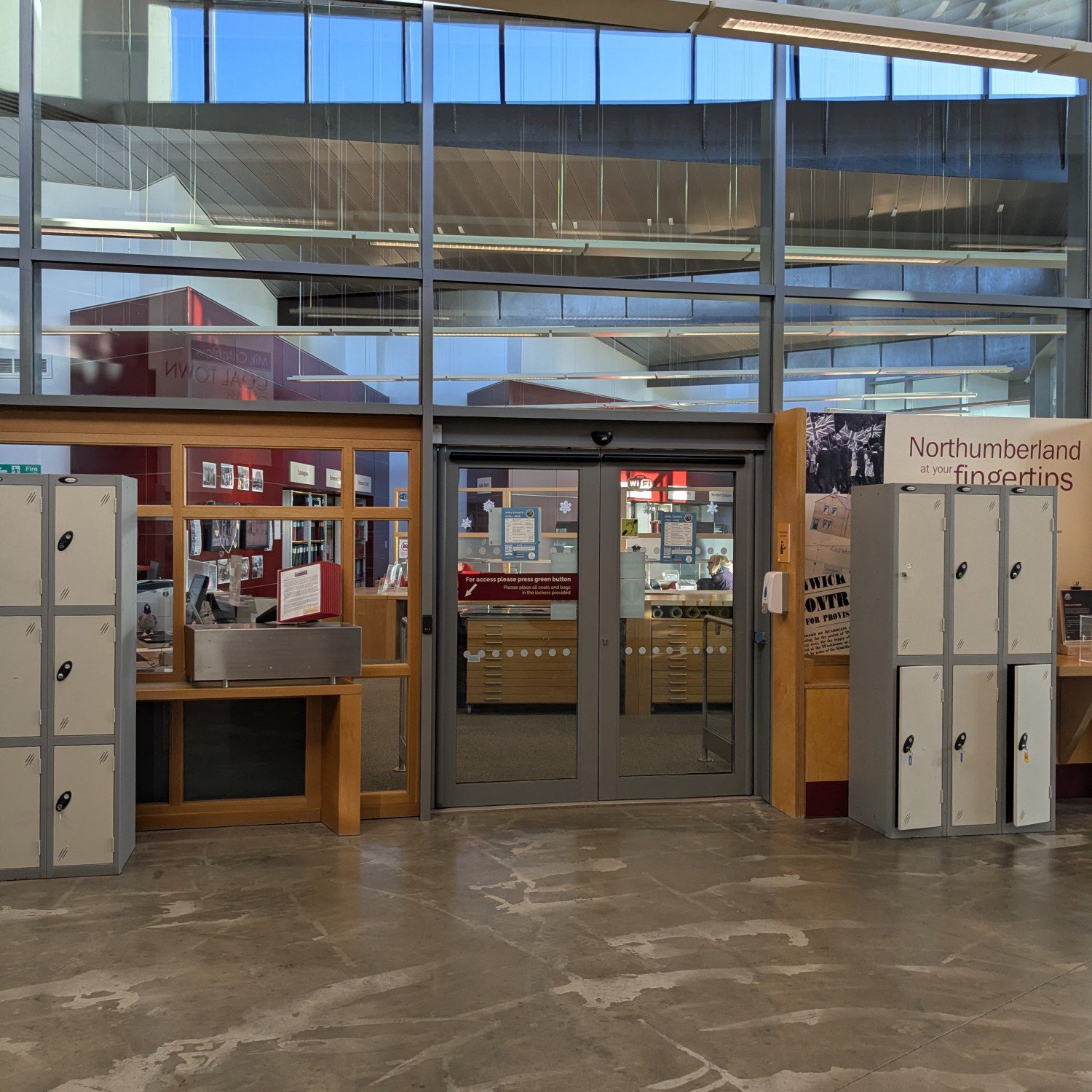 Glass doors of Northumberland Archives, a place to do historical research.