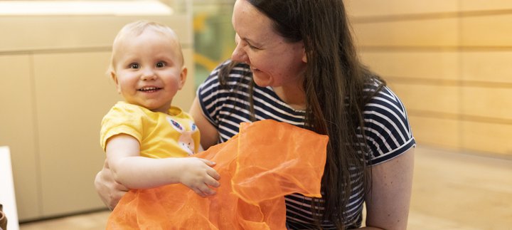 Woman and baby smiling