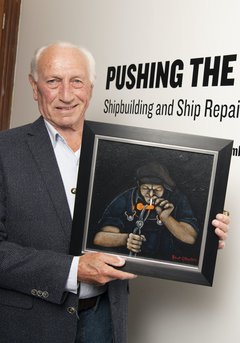 Robert (Bob) Olley holding his painting entitled ‘Fag Break’