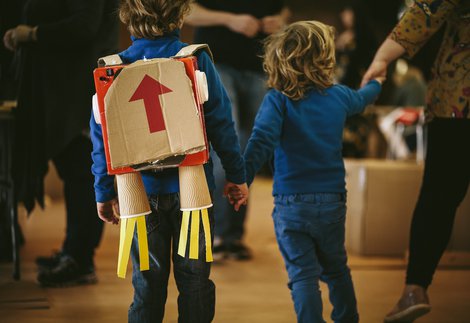 Children playing with cardboard