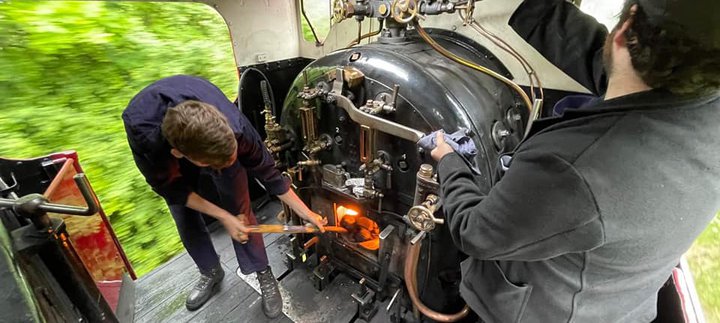 Image of fireman and train driver at work