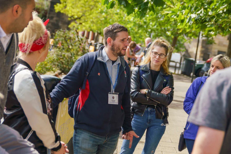 Tour guide talking to a group of people.