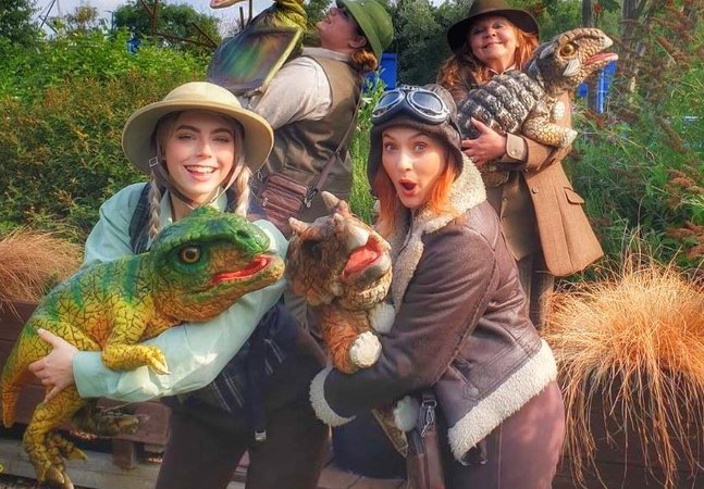 Puppeteers with dinosaurs puppets