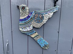 A decorative bird made of mosaic pieces