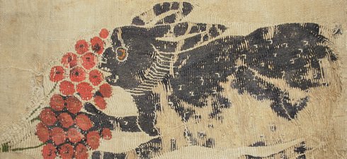 Textile showing a hare eating fruit
