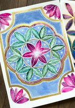 A selection of different watercolour paintings in geometric shapes.