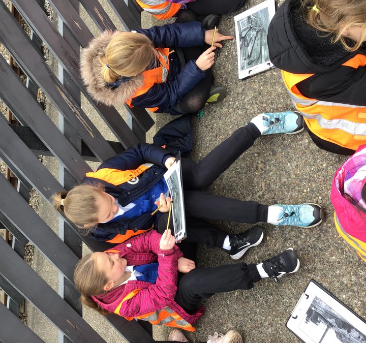 Children looking at a Woodland Walk Search at Stephenson Steam Railway