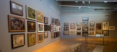 Gallery with paintings on the wall 