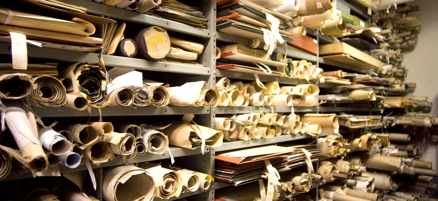 shelves full of large scrolls 