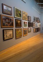 Gallery with paintings on the wall 
