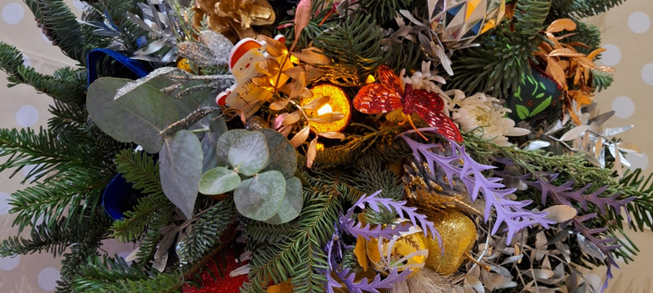 A floral bouquet with a variety of colourful flowers.