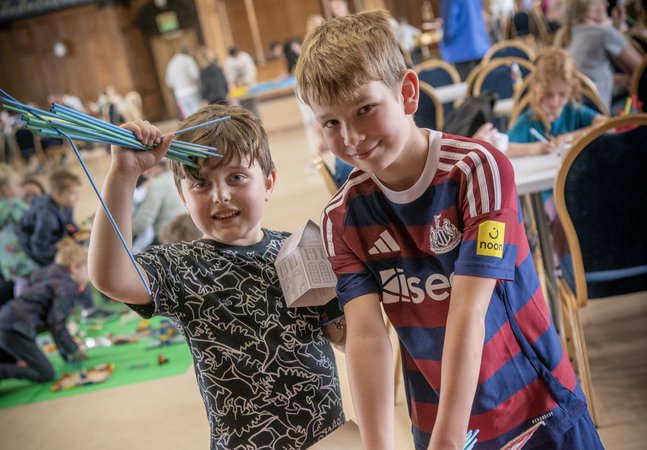 two boys at a creative vent in the Great Hall, Discovery Museum