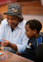 A photograph of a mum and child crafting.