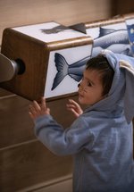 Young child at a museum interactive 