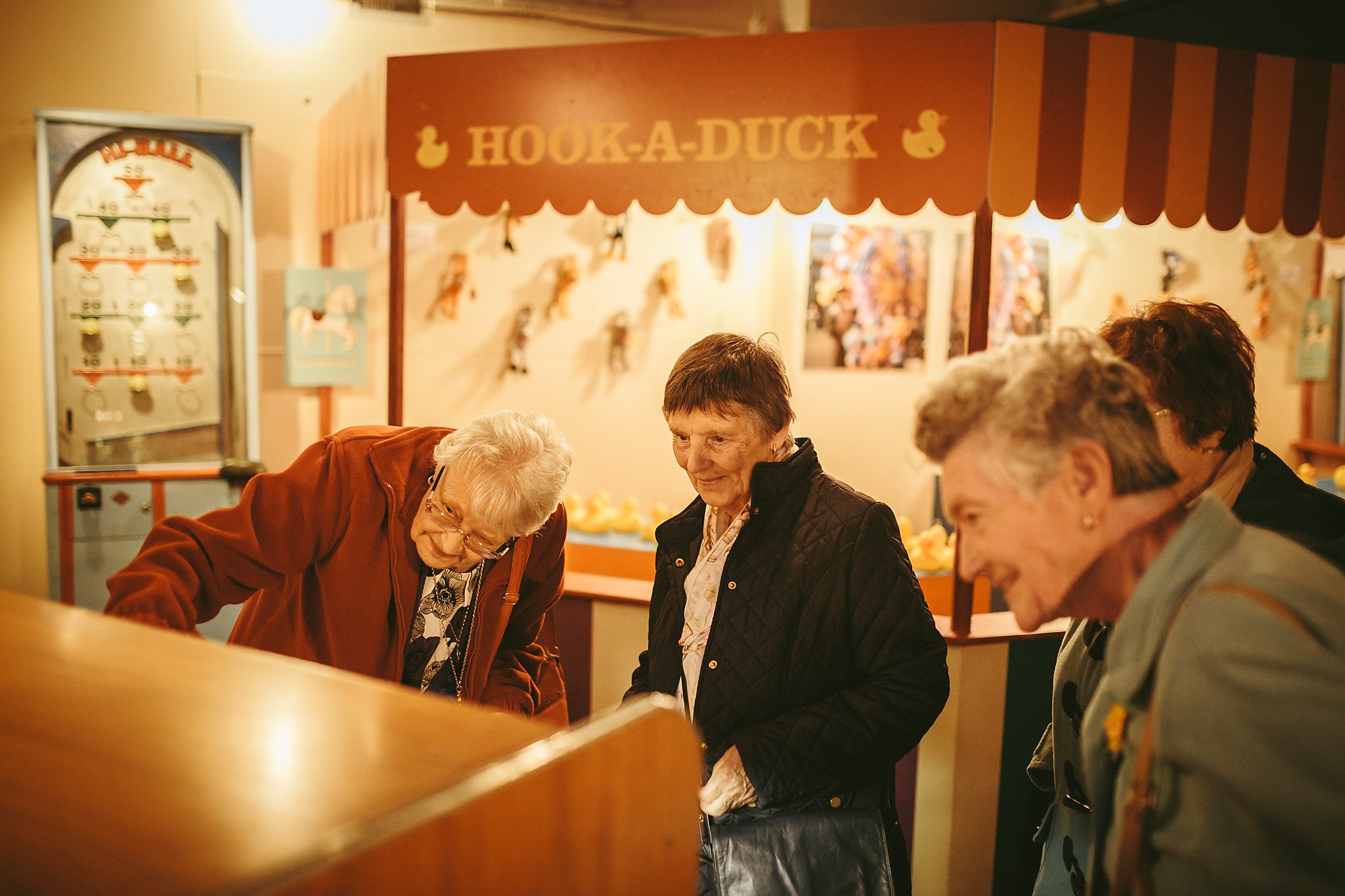 Older women looking at a display in a museum.