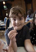 Two children grin in the Great Hall