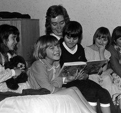 Photo of children enjoying a bedtime story at the Royal Victoria School for the Blind, Newcastle upon Tyne, 1982