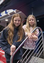 Two girls at RAF simulator ride 