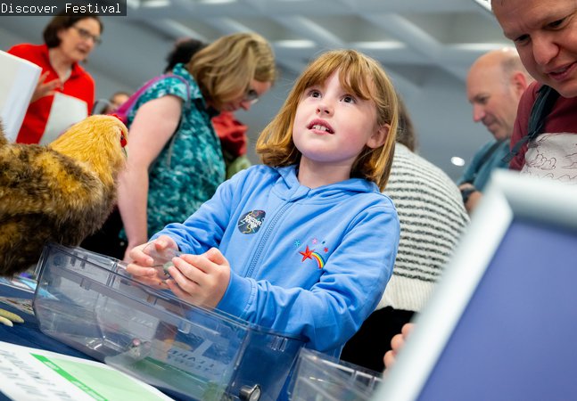 Discover Festival - a young child takes part in a worshop