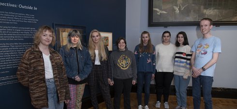 Young people at an art gallery.