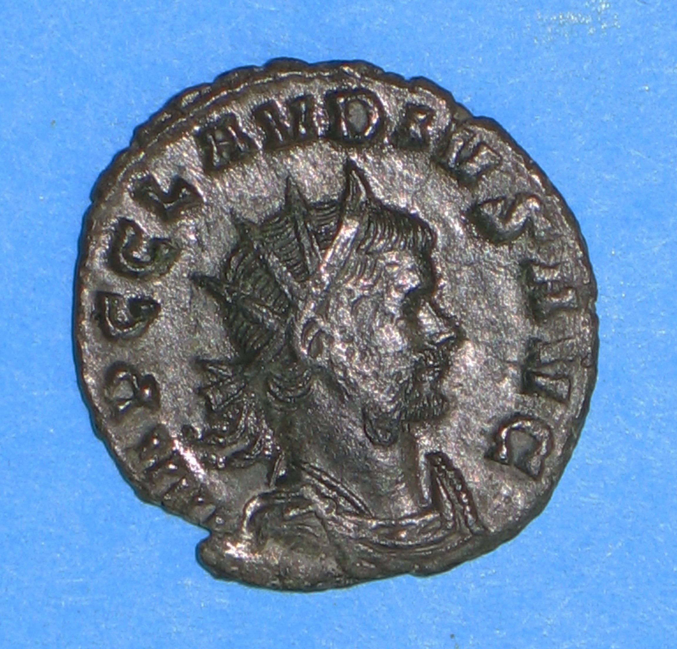 A Roman coin with the Emperor wearing a 'radiant crown'.