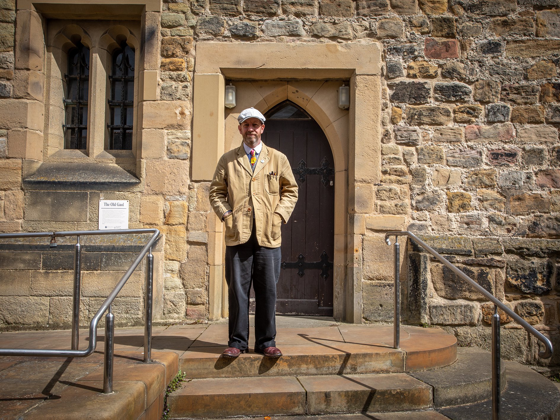 Artist Jonny Hannah standing in the doorway of the Old Gaol.