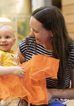 Woman and baby smiling