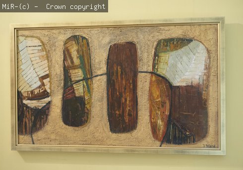 An abstract painting in earth colours on display. 