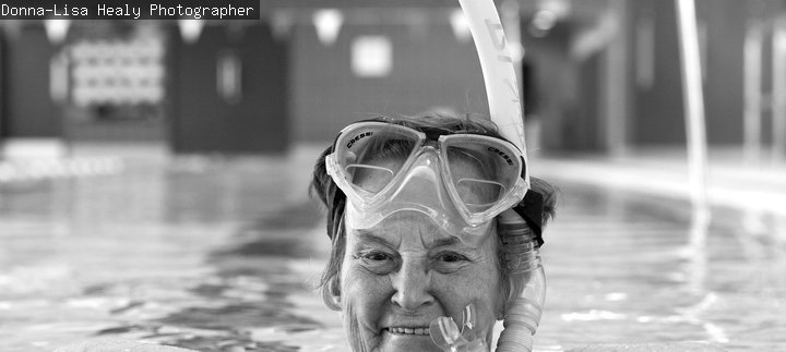 Woman in swimming pool wearing a snorkel