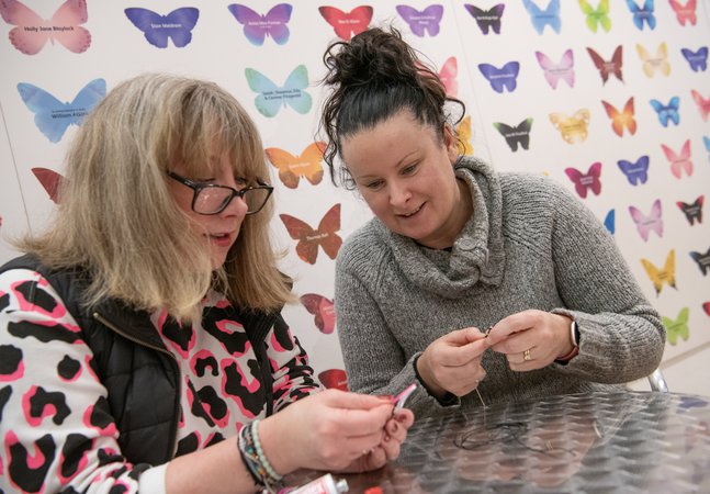 two women doing crafts 