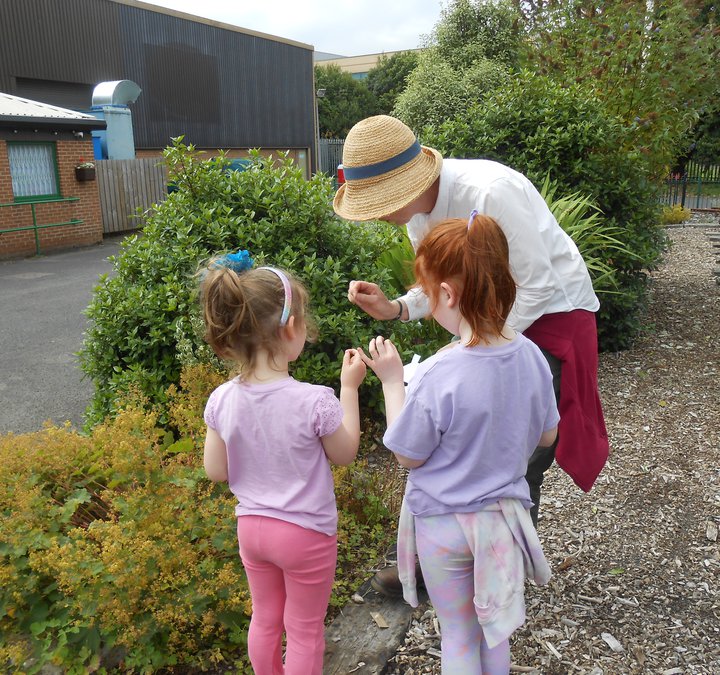 Children and adult in woodland walk area