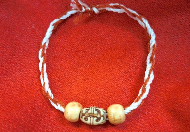 Roman style bracelet made of string and beads