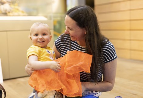 Woman and baby smiling