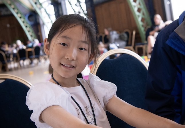 smiling girl does crafts