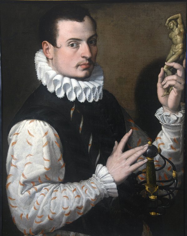 An oil painting of a young man wearing a large white neck ruff and sword. He is holding a small statuette An oil painting of a young man wearing a large white neck ruff and sword. He is holding a small statuette