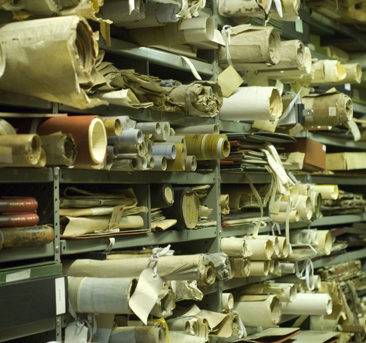 Photo of shelves of rolled up scrolls and papers