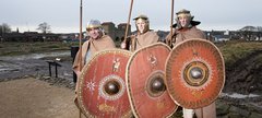 Three Roman soldiers with shields at Arbeia