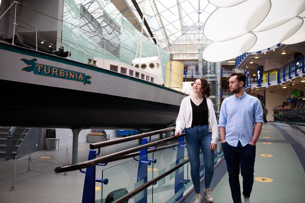 Visitors to Discovery Museum walk alongside Turbinia, the world’s first steam-turbine powered ship and once the fastest ship in the world. Made on Tyneside. 