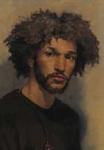 A portrait of a young man against a brown backdrop.