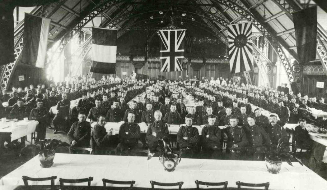 A group of military recruits pose for a portrait in Blandford House's Great Hall 