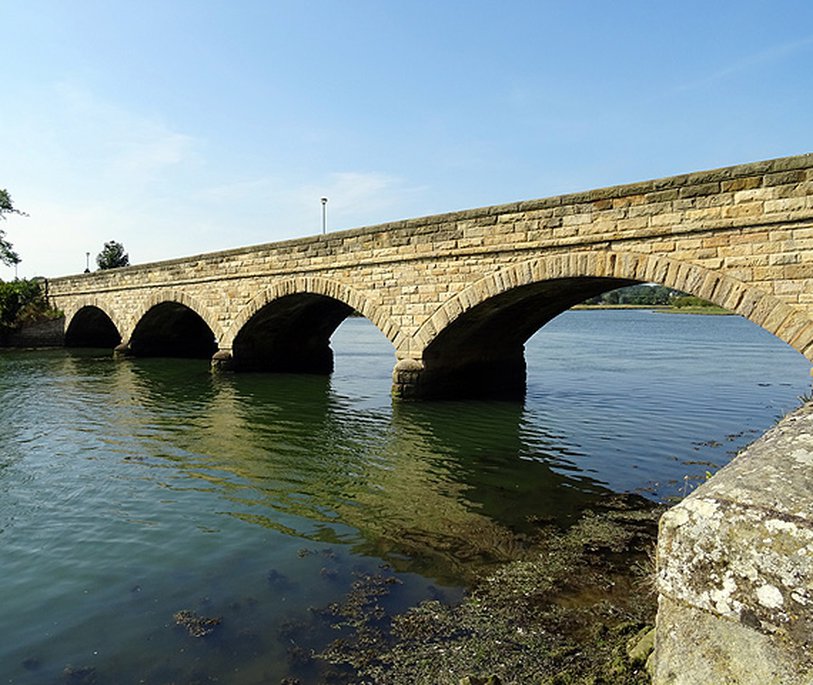 Road bridge over the River Aln On the approach to Alnmouth. Creative Commons Licence [Some Rights Reserved] © Copyright John Lucas and licensed for reuse under this Creative Commons Licence.