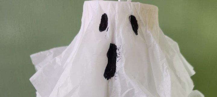 The face of a ghost crafted from white tissue